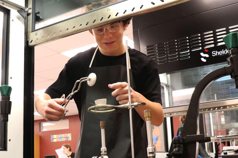 A Rockwood Summit High student works on an experiment in science class