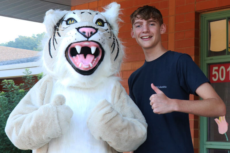 Two LaSalle Springs students smile while working together in class