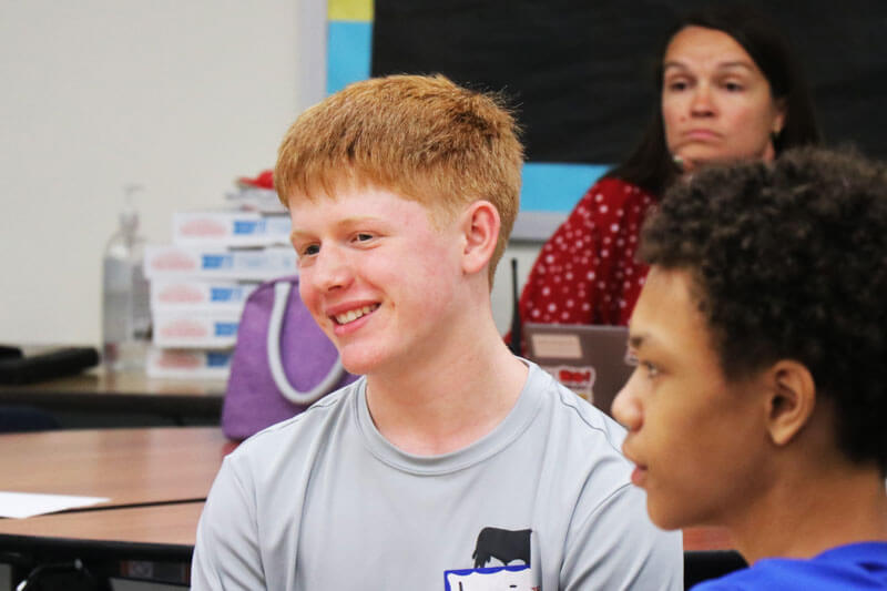 Rockwood South students listen to each other speak in class